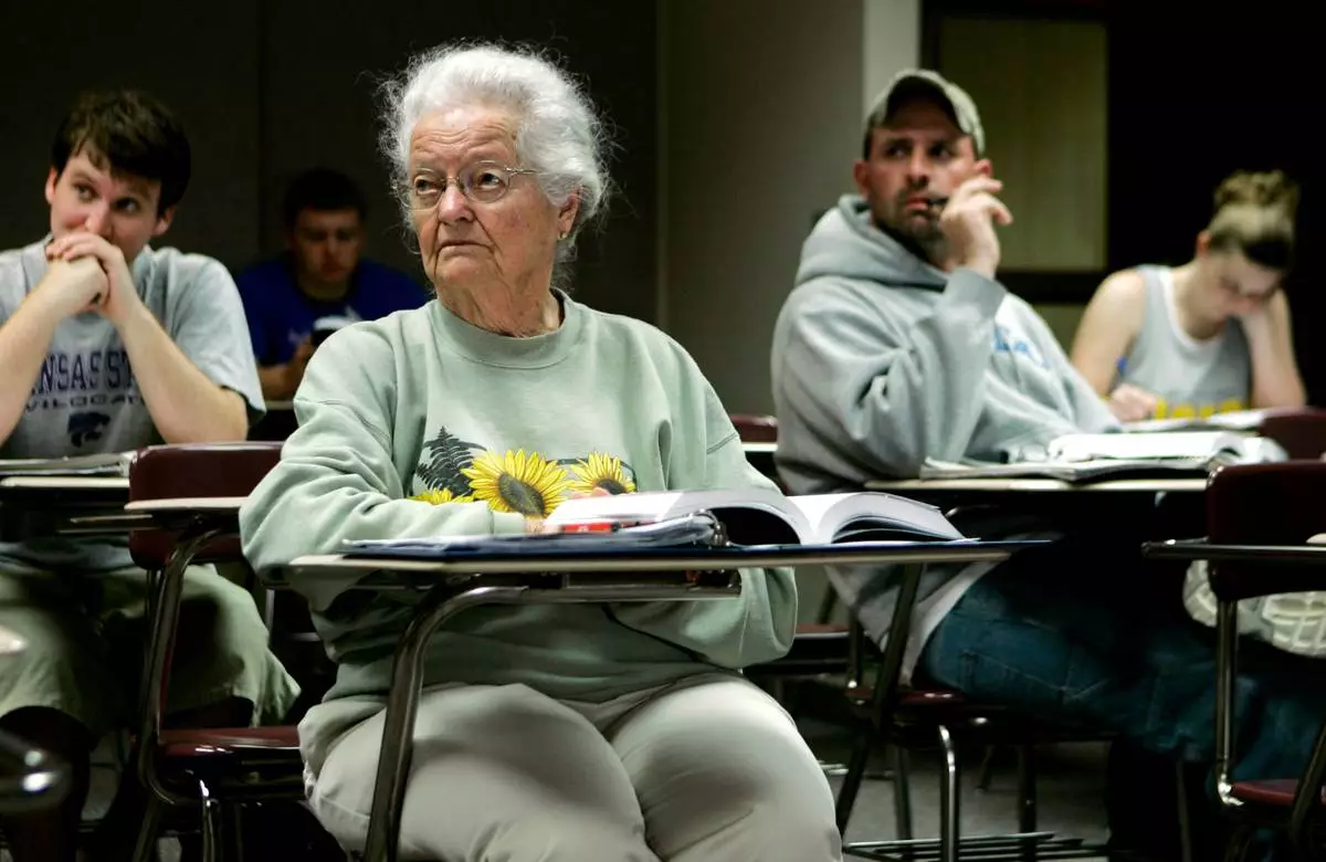 FILE - In this April 23, 2007 file photo, Nola Ochs listens to a lecture during a class at Fort Hays State University in Hays, Kan. (AP Photo/Charlie Riedel, File)