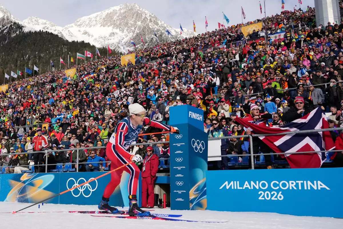 Silver medalist Vetle Sjaastad Christiansen, of Norway, crosses the finish line during the men's 10-kilometer sprint biathlon race at the 2026 Winter Olympics in Anterselva, Italy, Friday, Feb. 13, 2026. (AP Photo/David J. Phillip)