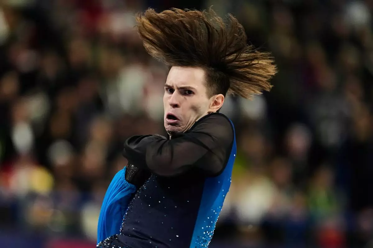 Mikhail Shaidorov of Kazakhstan competes during the men's free skate program in figure skating at the 2026 Winter Olympics, in Milan, Italy, Friday, Feb. 13, 2026. (AP Photo/Natacha Pisarenko)