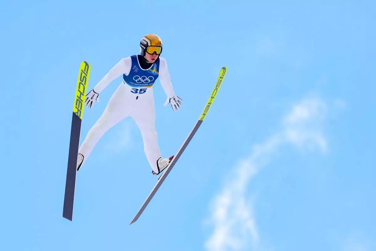 Jens Luraas Oftebro, of Norway, soars through the air during his competition round jump of the nordic combined individual Gundersen large hill/10km at the 2026 Winter Olympics, in Predazzo, Italy, Tuesday, Feb. 17, 2026. (AP Photo/Kirsty Wigglesworth)