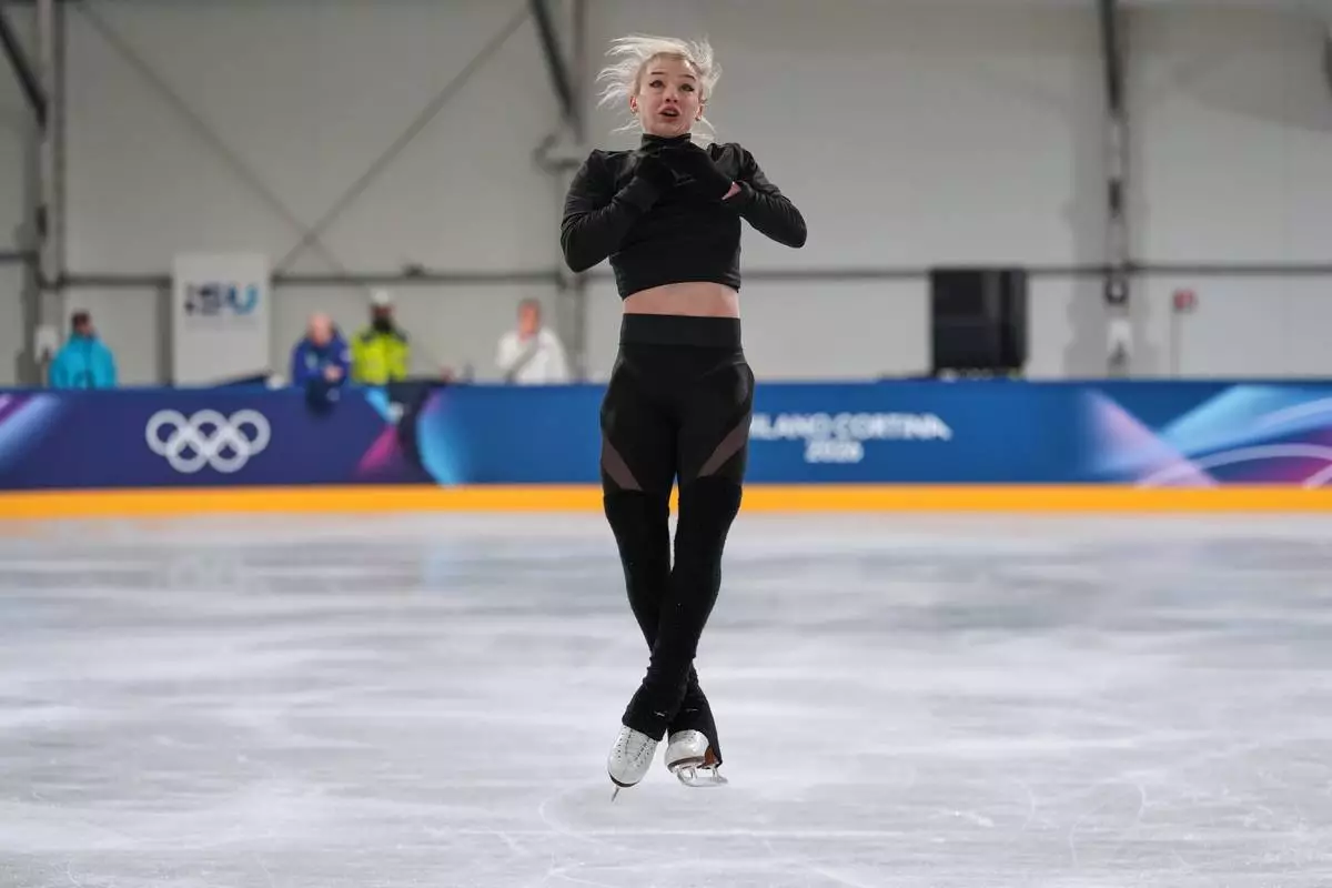 Amber Glenn, of the U.S., performs during a figure skating training session at the 2026 Winter Olympics, in Milan, Italy, Thursday, Feb. 5, 2026. (AP Photo/Francisco Seco)