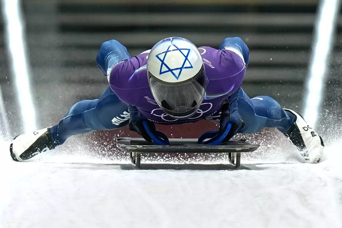Israel's Jared Firestone arrives at the finish during a men's skeleton training session at the 2026 Winter Olympics, in Cortina d'Ampezzo, Italy, Monday, Feb. 9, 2026. (AP Photo/Aijaz Rahi)