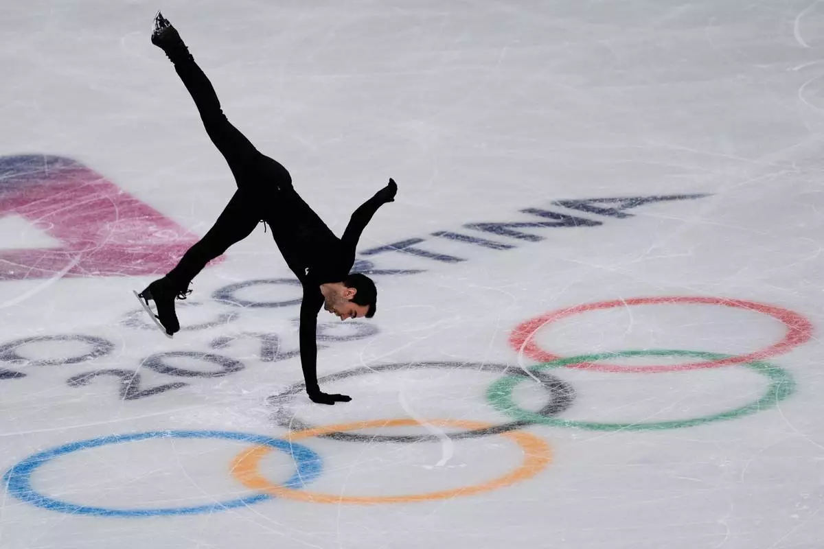 Tomas-Llorenc Guarino Sabate, of Spain, performs during a figure skating training session at the 2026 Winter Olympics, in Milan, Italy, Thursday, Feb. 5, 2026. (AP Photo/Stephanie Scarbrough)