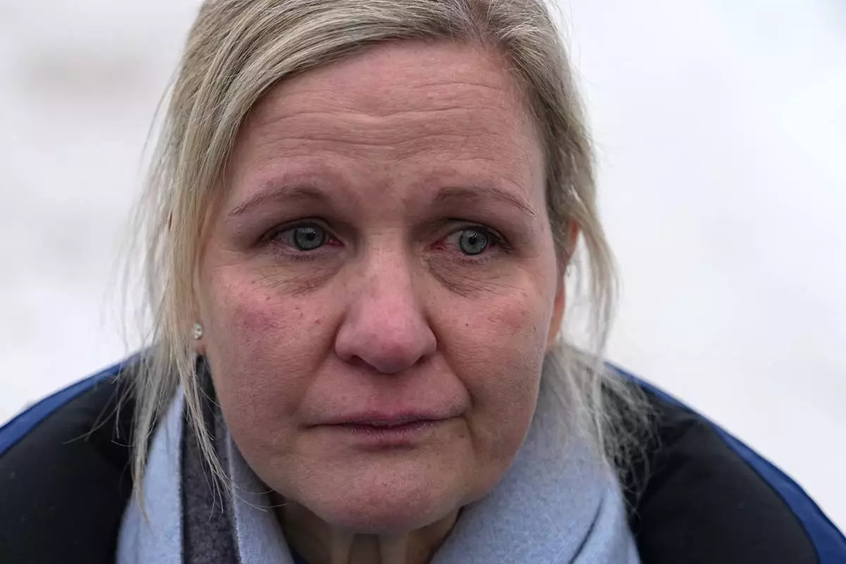 International Olympic Committee President Kirsty Coventry talks to the media at the start house of the sliding center at the 2026 Winter Olympics, in Cortina d'Ampezzo, Italy, Thursday, Feb. 12, 2026. (AP Photo/Fatima Shbair)