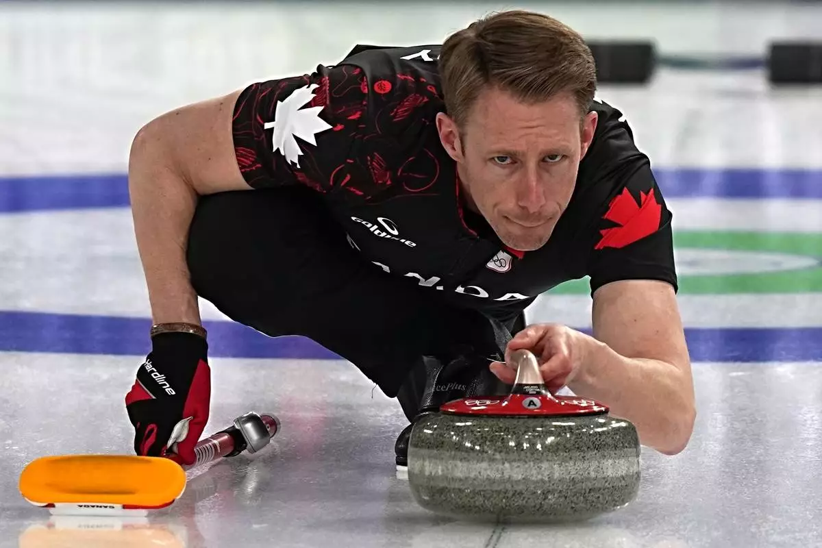 Canada's Marc Kennedy in action during the men's curling round robin session against the United States, at the 2026 Winter Olympics, in Cortina d'Ampezzo, Italy, Friday, Feb. 13, 2026. (AP Photo/Fatima Shbair)