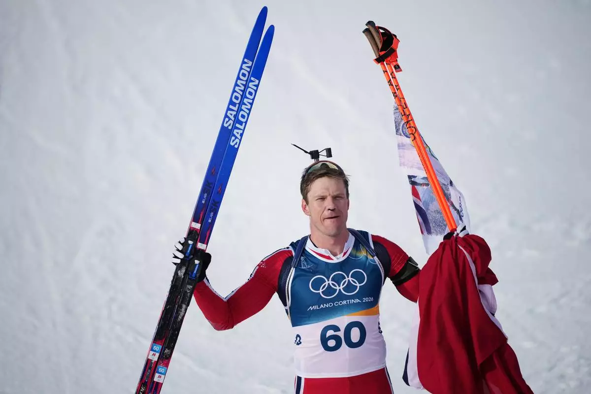 Vetle Sjaastad Christiansen, of Norway, reacts in the finish area of the men's 10-kilometer sprint biathlon race at the 2026 Winter Olympics in Anterselva, Italy, Friday, Feb. 13, 2026. (AP Photo/Andrew Medichini)
