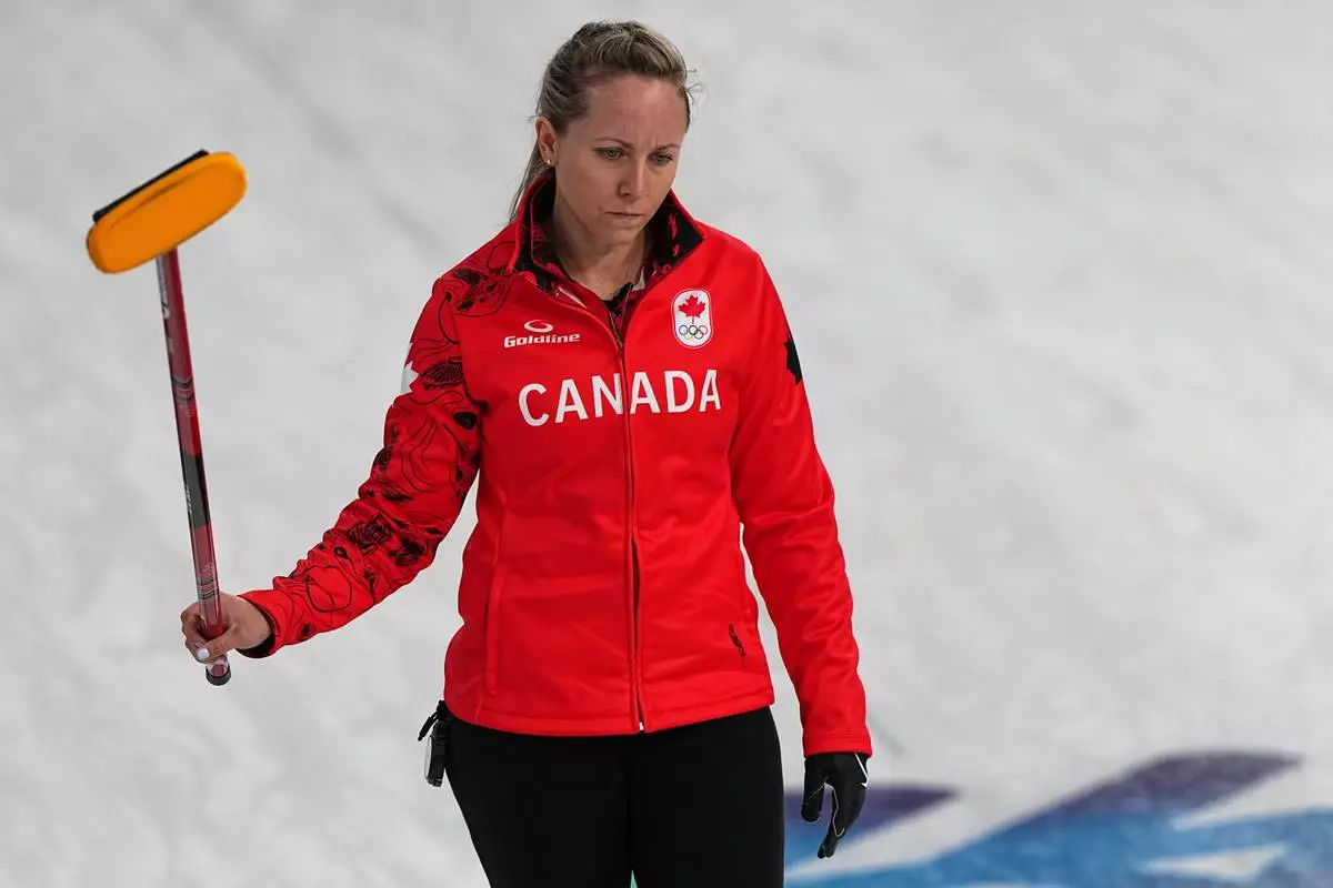 Canada's Rachel Homan, in action during the women's curling round robin session against Switzerland at the 2026 Winter Olympics, in Cortina d'Ampezzo, Italy, Saturday, Feb.14, 2026. (AP Photo/Fatima Shbair)