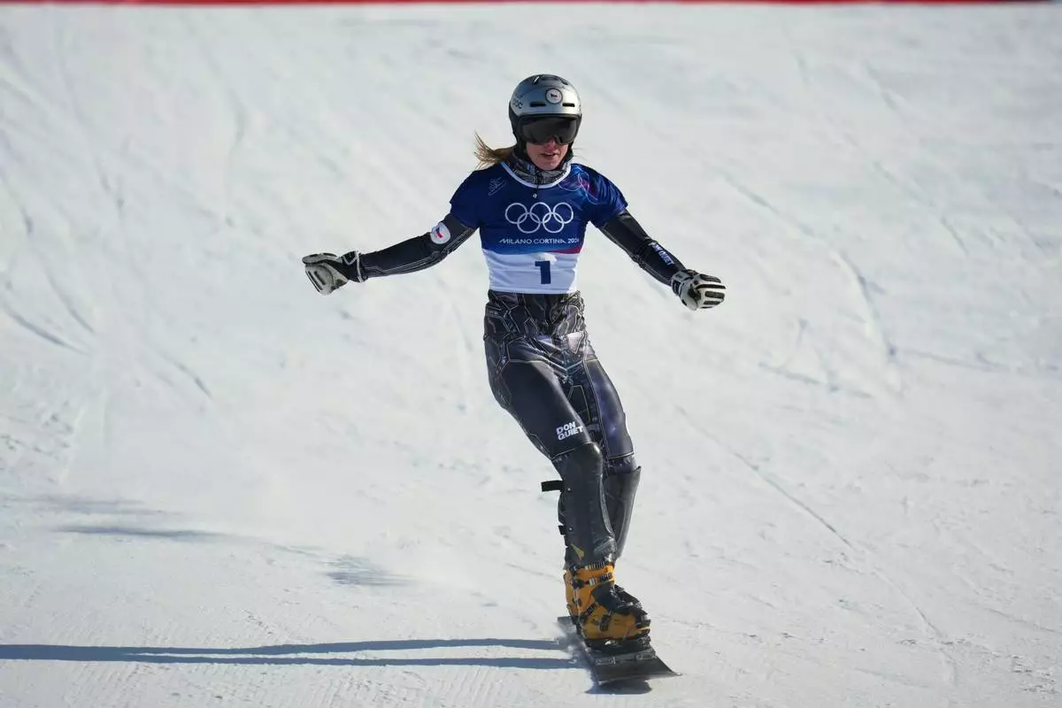 Czechia's Ester Ledecka reacts after finishing behind Austria's Sabine Payer during the women's snowboarding parallel giant slalom finals at the 2026 Winter Olympics, in Livigno, Italy, Sunday, Feb. 8, 2026. (AP Photo/Abbie Parr)
