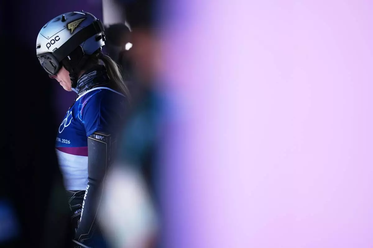Czechia's Ester Ledecka waits to compete during the women's snowboarding parallel giant slalom finals at the 2026 Winter Olympics, in Livigno, Italy, Sunday, Feb. 8, 2026. (AP Photo/Gregory Bull)