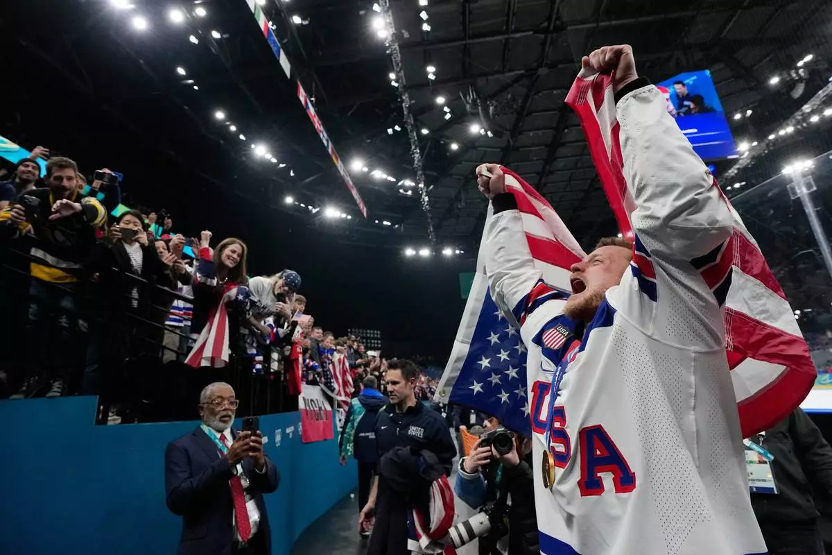 United States' Jack Eichel celebrates after the United States defeated Canada in a men's ice hockey gold medal game between Canada and the United States at the 2026 Winter Olympics, in Milan, Italy, Sunday, Feb. 22, 2026. (AP Photo/Petr David Josek)