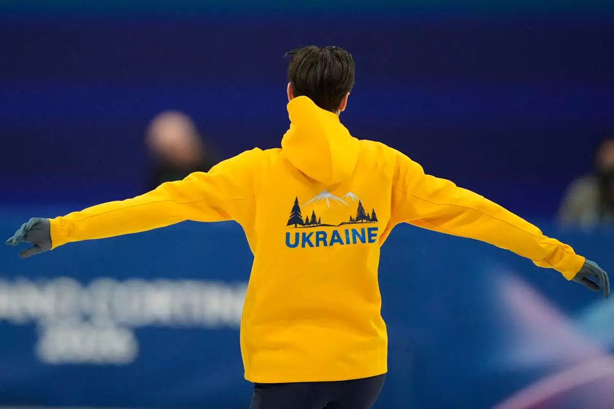 Kyrylo Marsak of Ukraine prepares to skate before the men's figure skating short program at the 2026 Winter Olympics, in Milan, Italy, Tuesday, Feb. 10, 2026. (AP Photo/Ashley Landis)
