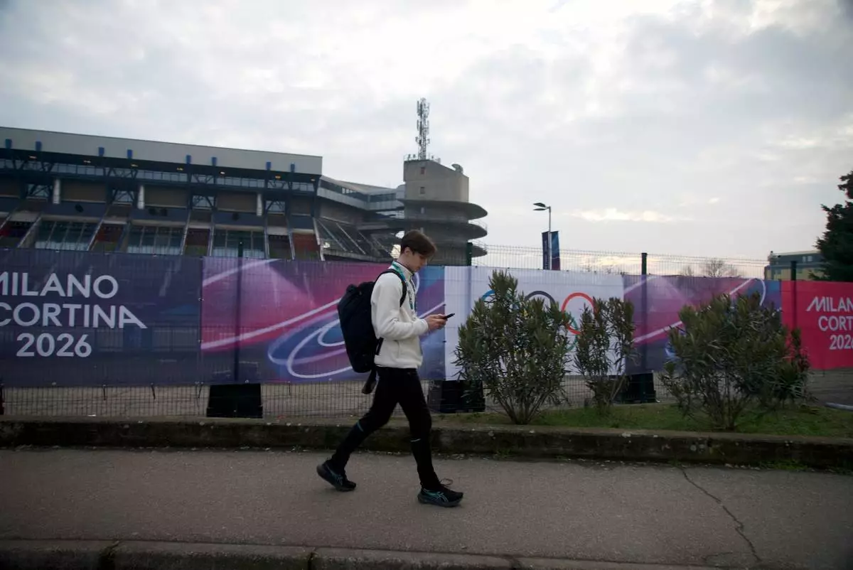 Ukrainian figure skater Kyrylo Marsak walks outside the Milan ice skating arena on his way to practice his routine, at the 2026 Winter Olympics, in Milan, Italy, Sunday, Feb. 8, 2026. (AP Photo/Vasilisa Stepanenko)