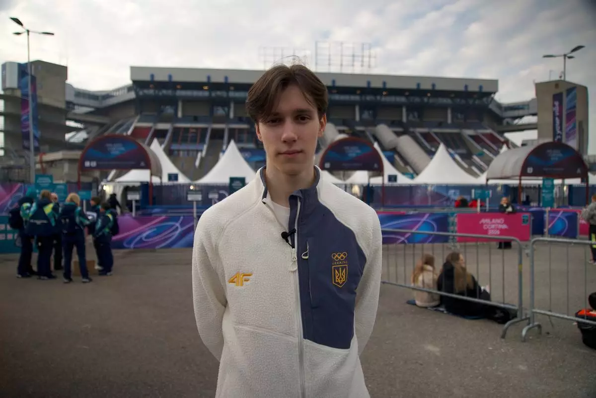 Ukrainian figure skater Kyrylo Marsak poses for a photo outside the Milan ice skating arena on his way to practice his routine, at the 2026 Winter Olympics, in Milan, Italy, Sunday, Feb. 8, 2026. (AP Photo/Vasilisa Stepanenko)