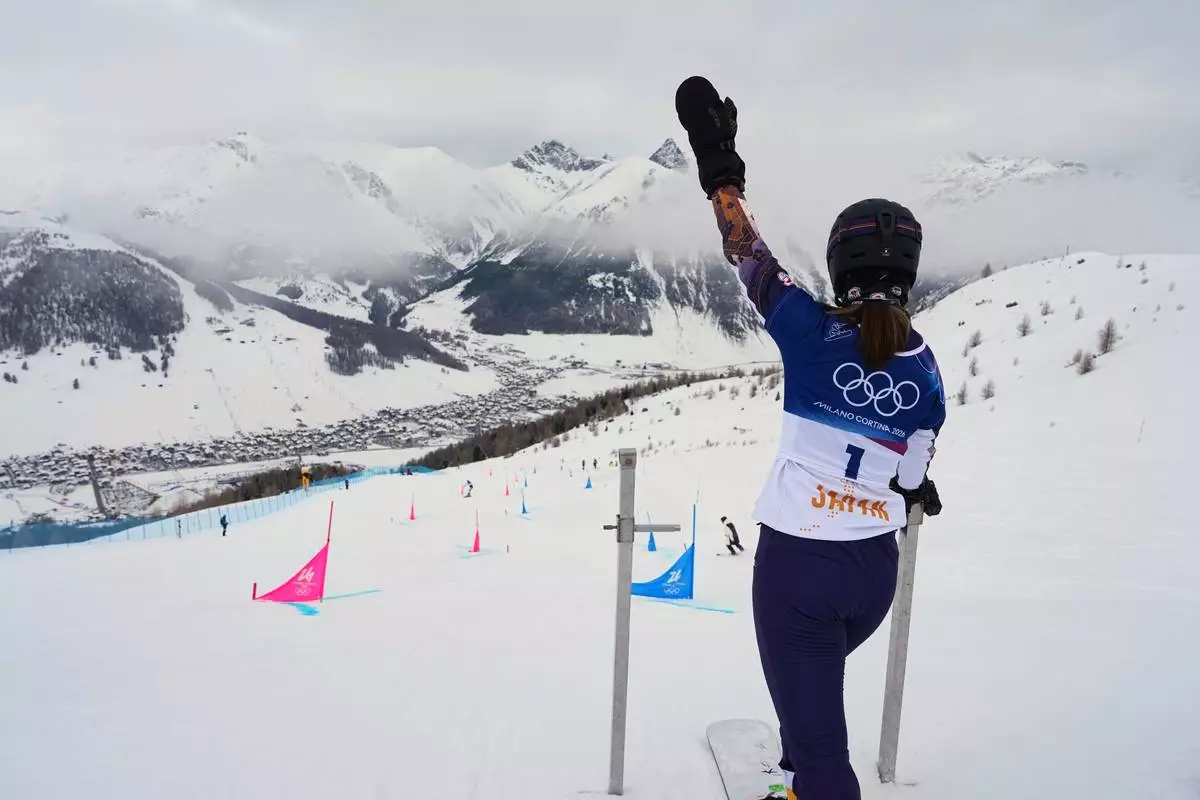 Japan's Tsubaki Miki waves to coaches during a snowboard parallel giant slalom training session at the 2026 Winter Olympics, in Livigno, Italy, Friday, Feb. 6, 2026. (AP Photo/Gregory Bull)