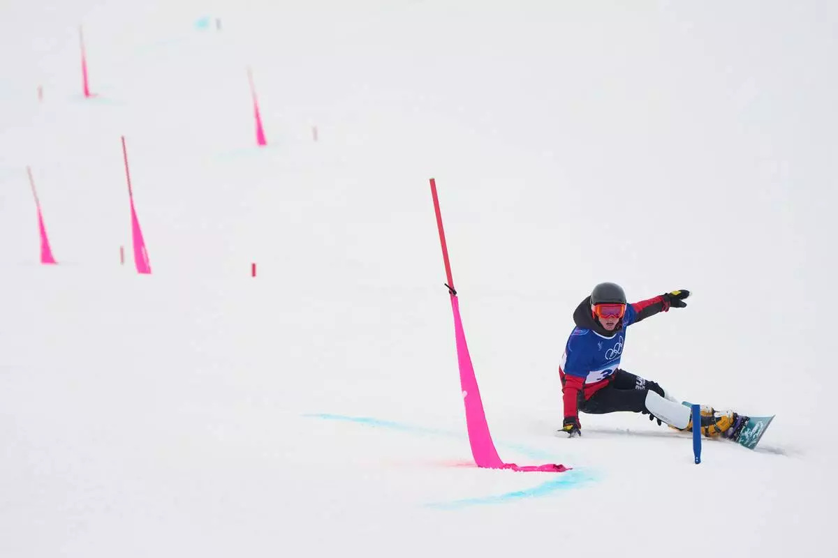 Bulgaria's Alexander Krashniak practices during a snowboard parallel giant slalom training session at the 2026 Winter Olympics, in Livigno, Italy, Friday, Feb. 6, 2026. (AP Photo/Gregory Bull)