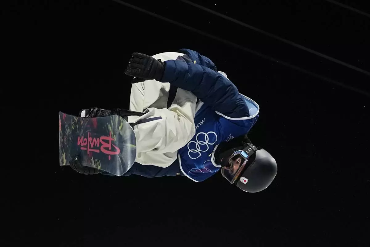 Japan's Ayumu Hirano practices during a snowboard halfpipe training session at the 2026 Winter Olympics, in Livigno, Italy, Sunday, Feb. 8, 2026. (AP Photo/Lindsey Wasson)