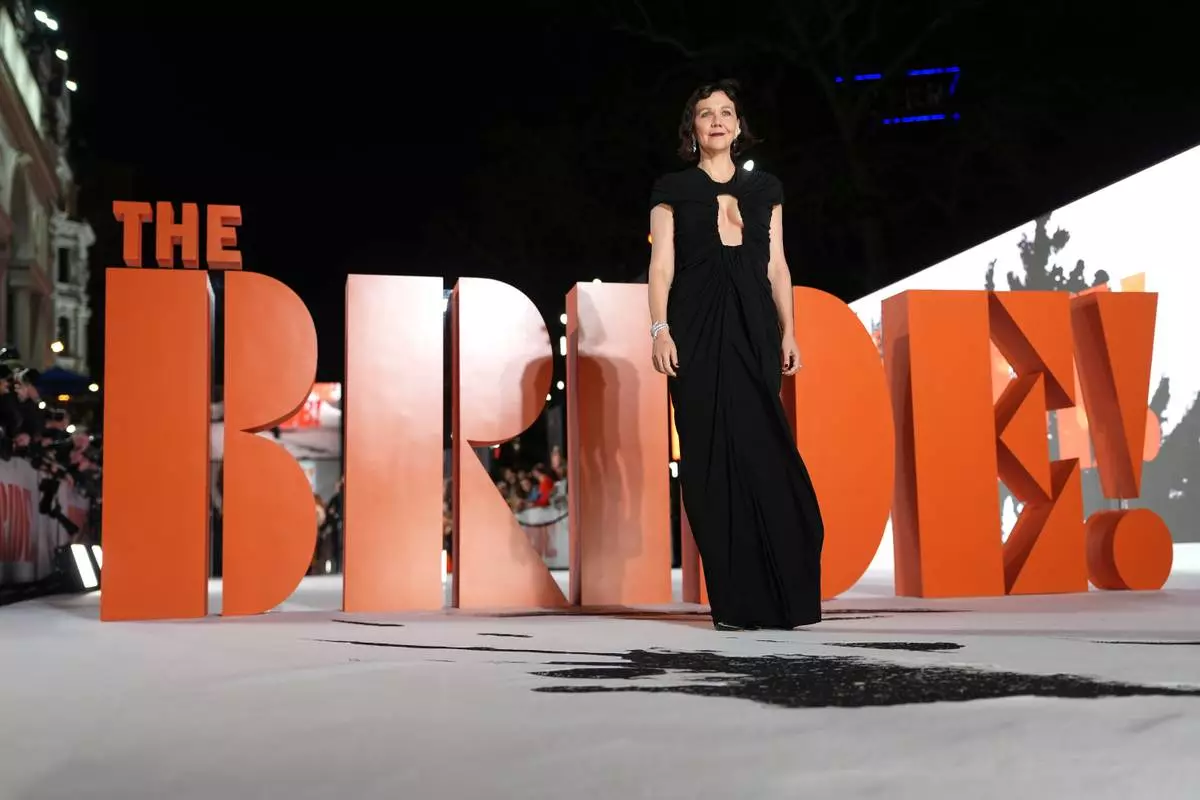 CAPTION CORRECTS THE FILM TITLE - Director Maggie Gyllenhaal poses for photographers upon arrival at the World premiere for the film "The Bride!" in London, Thursday, Feb. 26, 2026. (Photo by Scott A Garfitt/Invision/AP)