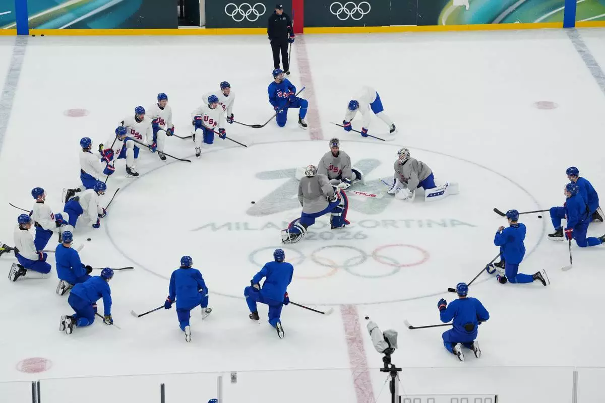 The United States men's ice hockey team gathers on the ice during practice at the 2026 Winter Olympics, in Milan, Italy, Sunday, Feb. 8, 2026. (AP Photo/Carolyn Kaster)