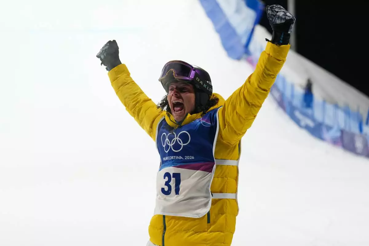 Australia's Valentino Guseli celebrates during men's snowboard big air qualifications at the 2026 Winter Olympics, in Livigno, Italy, Thursday, Feb. 5, 2026. (AP Photo/Abbie Parr)