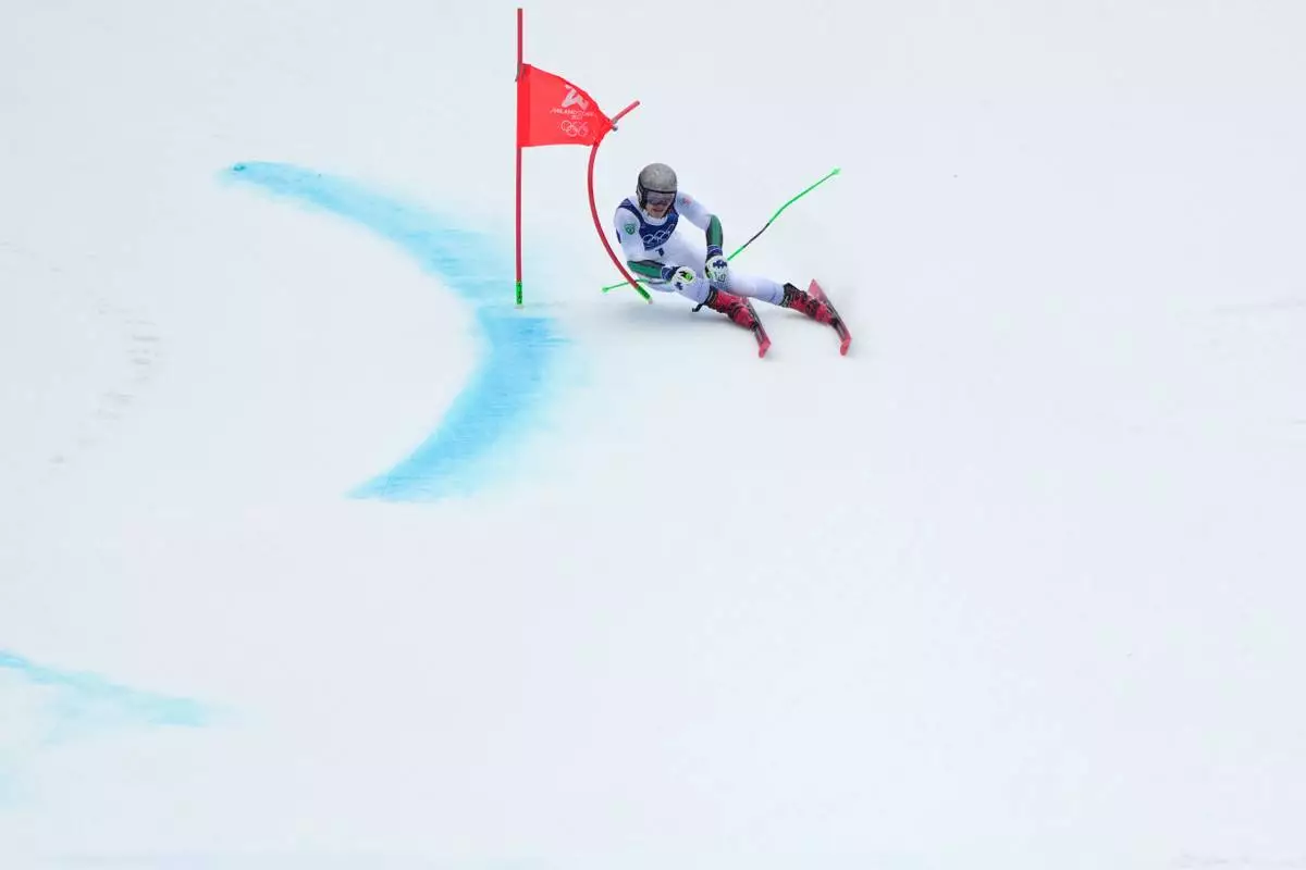Brazil's Lucas Pinheiro Braathen speeds down the course to win an alpine ski, men's giant slalom race, at the 2026 Winter Olympics, in Bormio, Italy, Saturday, Feb. 14, 2026. (AP Photo/John Locher)