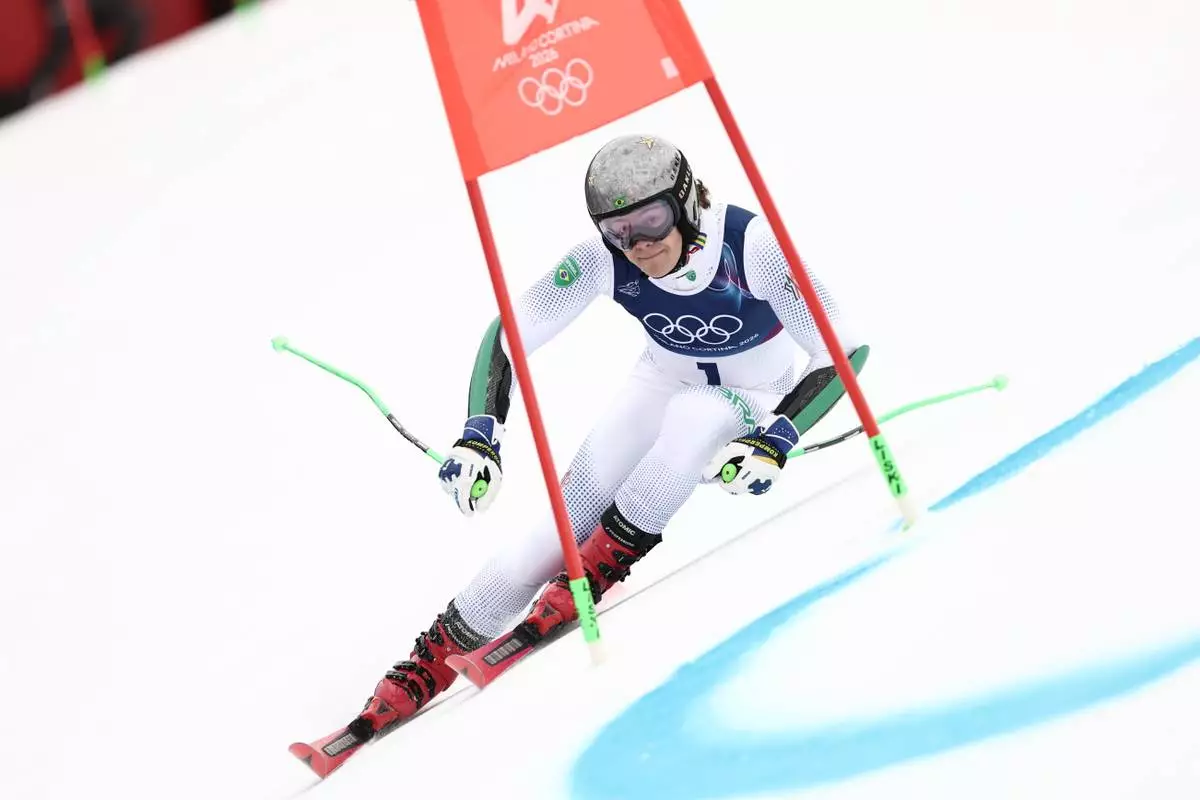 Brazil's Lucas Pinheiro Braathen speeds down the course, during an alpine ski, men's giant slalom race, at the 2026 Winter Olympics, in Bormio, Italy, Saturday, Feb. 14, 2026. (AP Photo/Gabriele Facciotti)