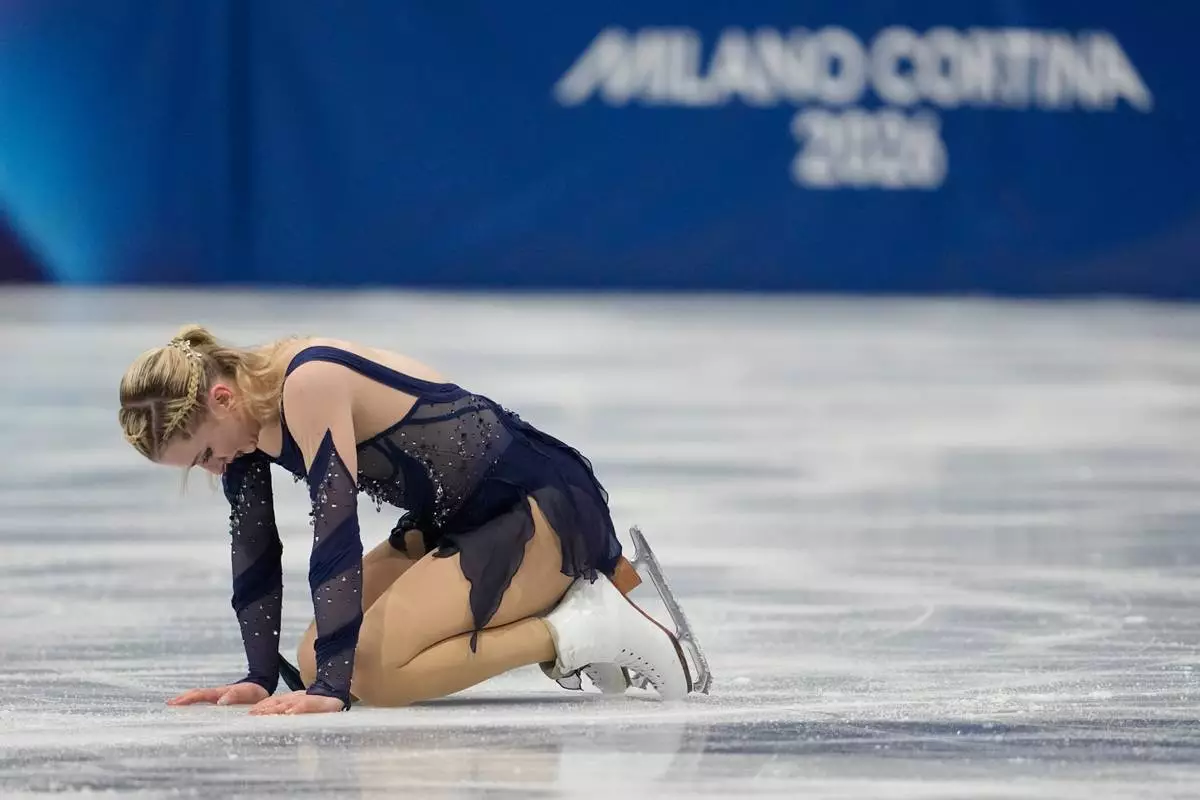 Amber Glenn of the United States competes during the figure skating women's team event at the 2026 Winter Olympics, in Milan, Italy, Sunday, Feb. 8, 2026. (AP Photo/Ashley Landis)