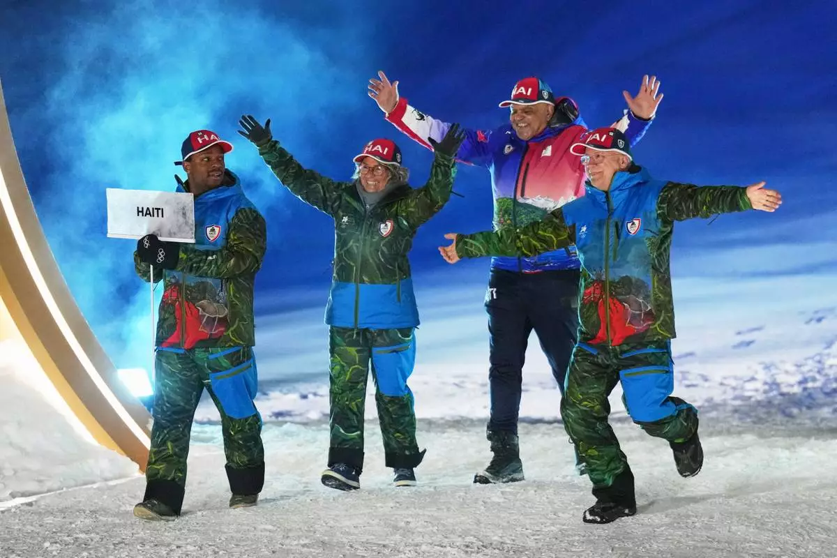 Athletes from Haiti walk during the Olympic opening ceremony at the 2026 Winter Olympics, in Livigno, Italy, Friday, Feb. 6, 2026. (AP Photo/Abbie Parr)