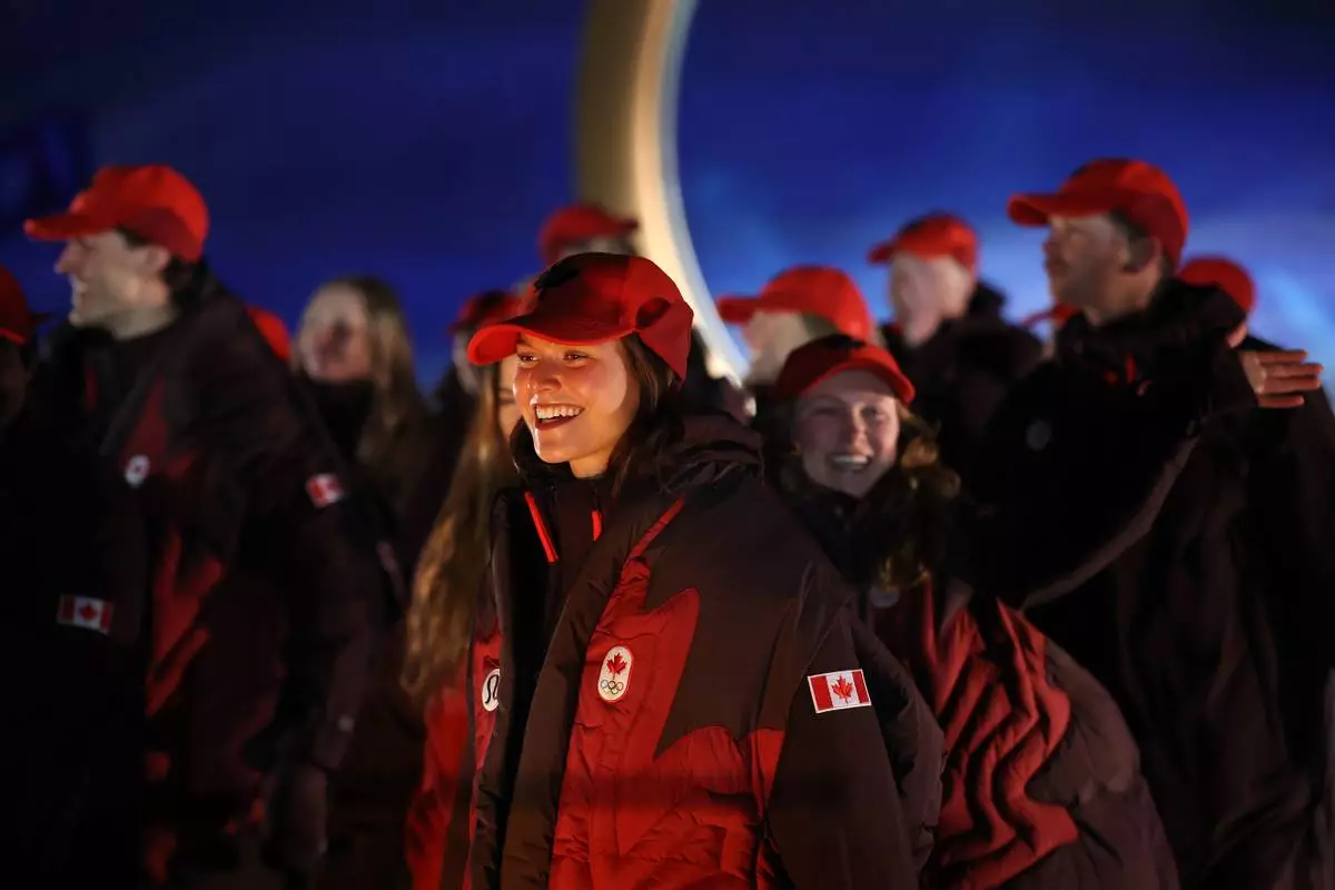 Athletes from Canada walk during the Olympic opening ceremony at the 2026 Winter Olympics, in Livigno, Italy, Friday, Feb. 6, 2026. (Cameron Spencer/Pool Photo via AP)