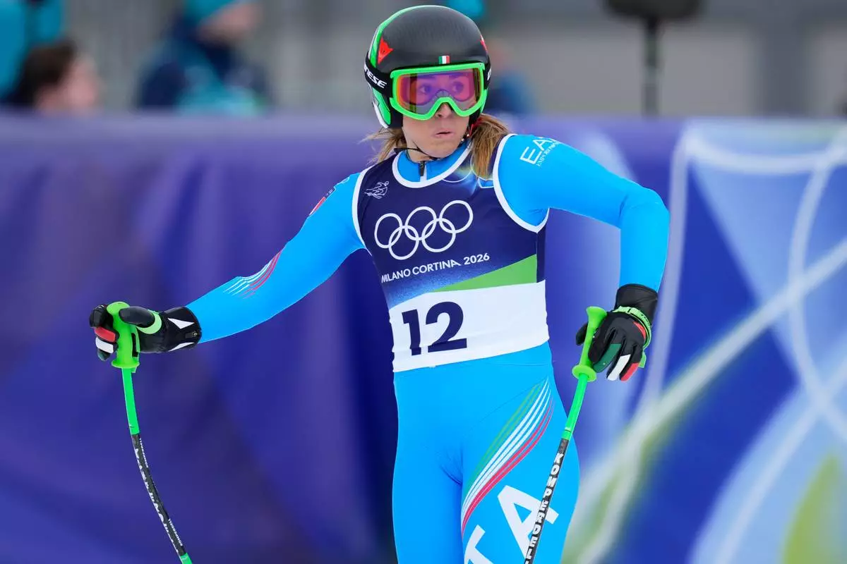 Italy's Sofia Goggia at the finish area during an alpine ski, women's downhill official training, at the 2026 Winter Olympics, in Cortina d'Ampezzo, Italy, Friday, Feb. 6, 2026. (AP Photo/Giovanni Auletta)