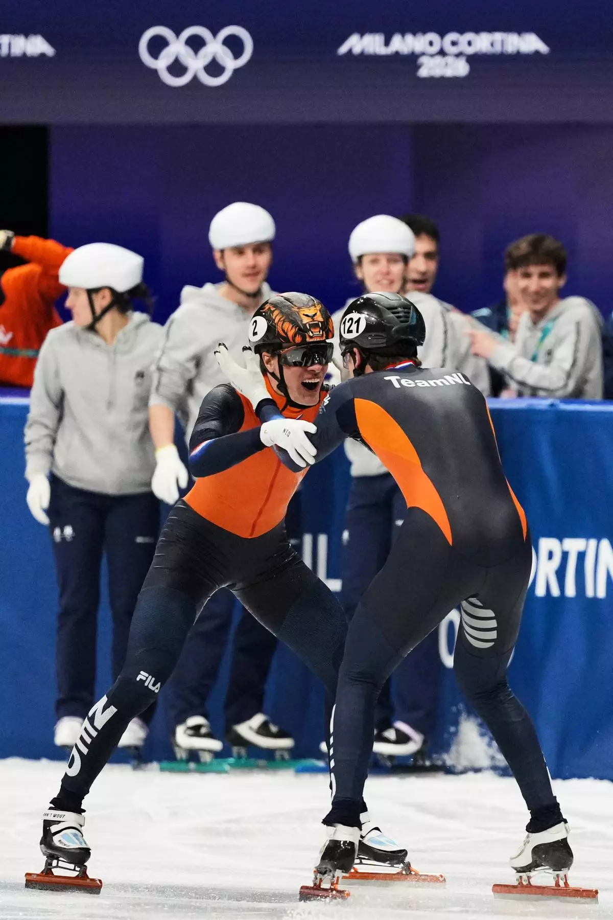 Melle van 't Wout of the Netherlands wins silver, right, and Jens van 't Wout of the Netherlands wins bronze during the short track speed skating men's 500m at the 2026 Winter Olympics, in Milan, Italy, Wednesday, Feb. 18, 2026. (AP Photo/Stephanie Scarbrough)