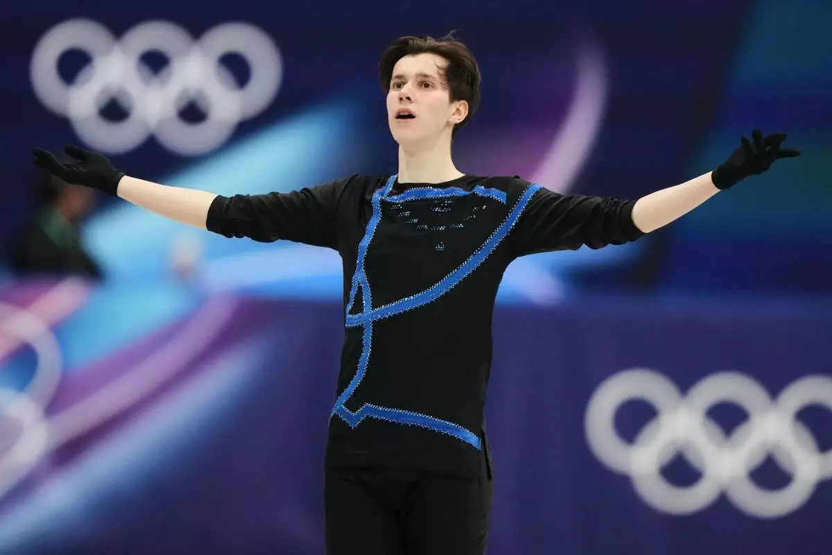 Kyrylo Marsak of Ukraine competes during the men's free skate program in figure skating at the 2026 Winter Olympics, in Milan, Italy, Friday, Feb. 13, 2026. (AP Photo/Natacha Pisarenko)