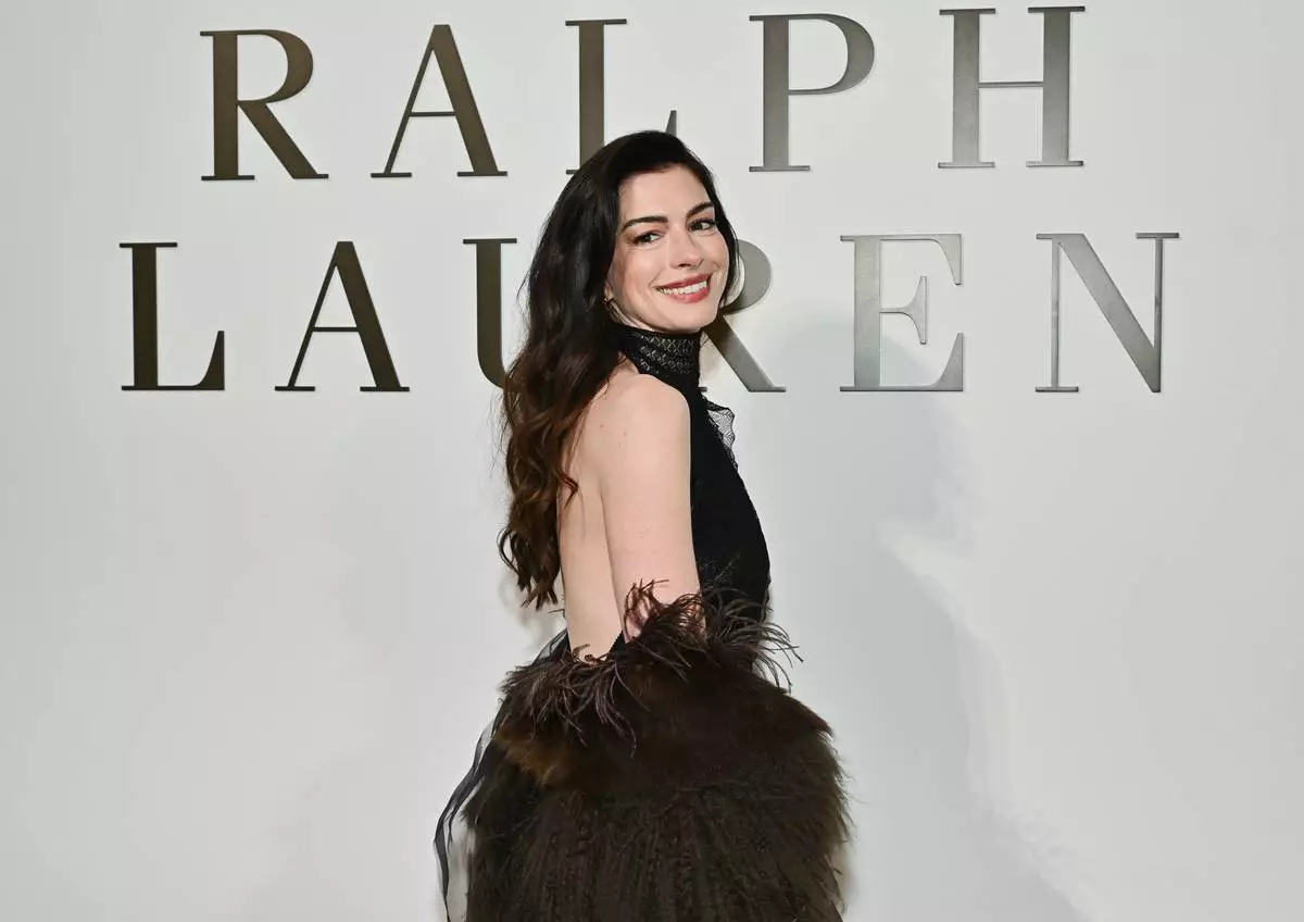 Anne Hathaway attends the Ralph Lauren Fall/Winter 2026 fashion show as part of New York Fashion Week on Tuesday, Feb. 10, 2026, in New York. (Photo by Evan Agostini/Invision/AP)