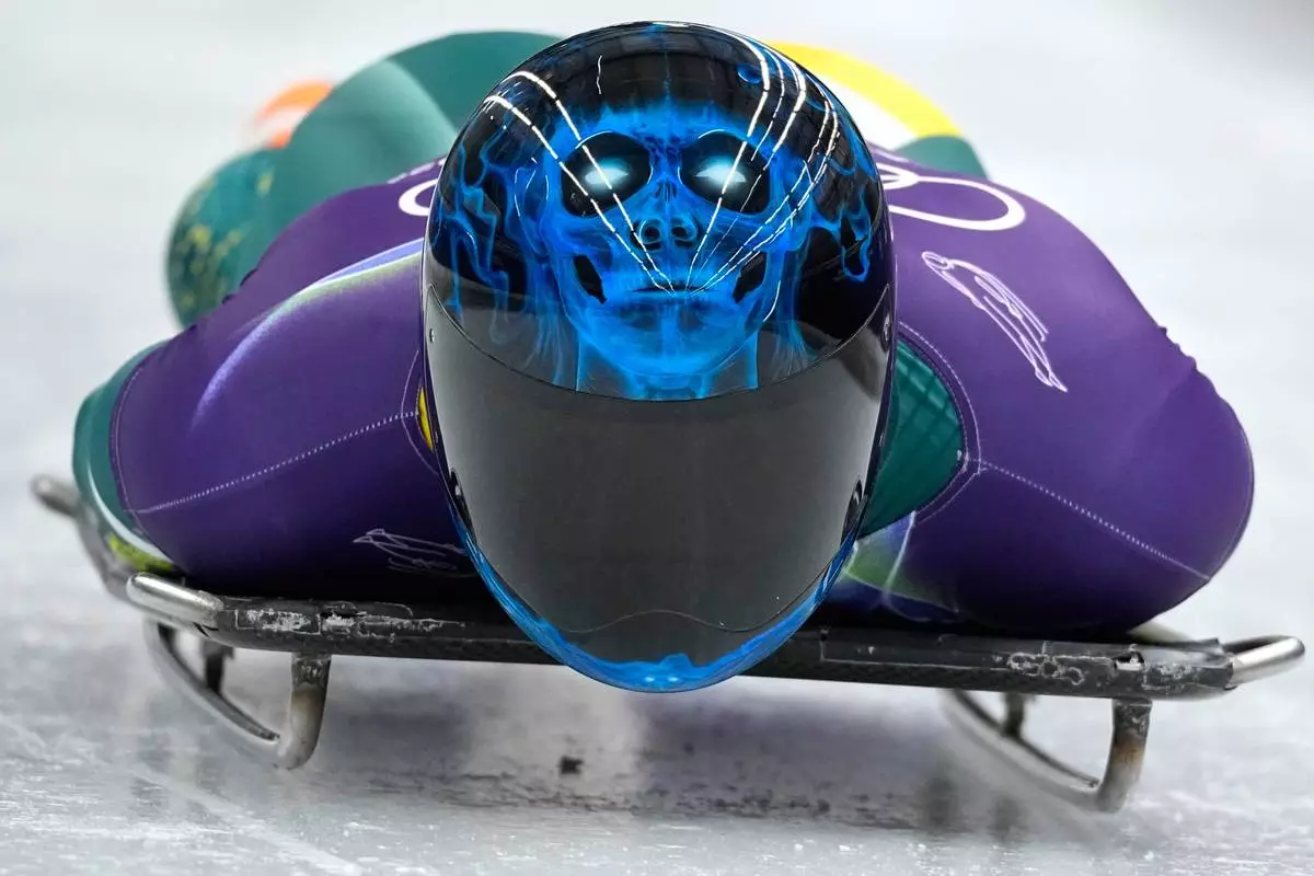 Australia's Nicholas Timmings starts for a men's skeleton training session at the 2026 Winter Olympics, in Cortina d'Ampezzo, Italy, Monday, Feb. 9, 2026. (AP Photo/Alessandra Tarantino)