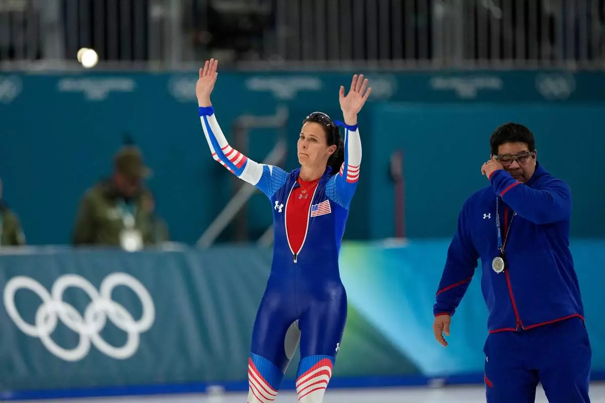 Fourth placed Brittany Bowe of the U.S. and her coach Ryan Shimabukuro react after the women's 1500 meters speedskating race at the 2026 Winter Olympics, in Milan, Italy, Friday, Feb. 20, 2026. (AP Photo/Ben Curtis)