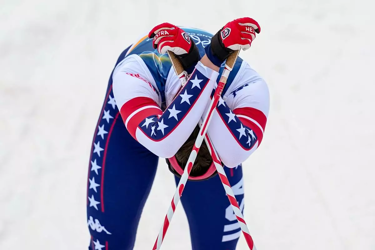 Julia Kern, of the United States reacts after crossing the finish line in a semifinal of the cross-country skiing women's sprint classic at the 2026 Winter Olympics, in Tesero, Italy, Tuesday, Feb. 10, 2026. (AP Photo/Matthias Schrader)