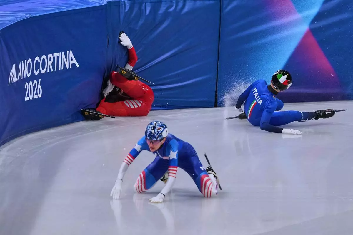 Kamila Sellier of Poland falls during a short track speed skating women's 1500 meters quarterfinal at the 2026 Winter Olympics, in Milan, Italy, Friday, Feb. 20, 2026. (AP Photo/Stephanie Scarbrough)