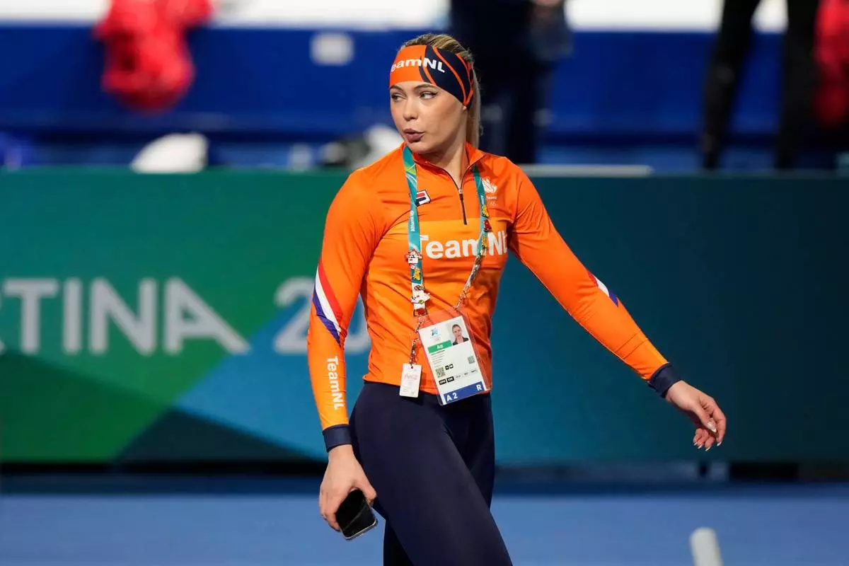 Jutta Leerdam of the Netherlands walks inside the venue ahead of the women's 3,000 meters speedskating race at the 2026 Winter Olympics, in Milan, Italy, Saturday, Feb. 7, 2026. (AP Photo/Luca Bruno)