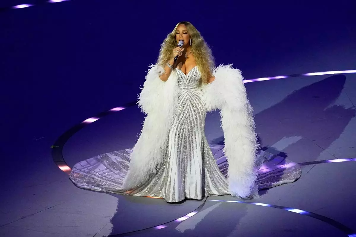 Singer Mariah Carey performs during the Olympic opening ceremony at the 2026 Winter Olympics, in Milan, Italy, Friday, Feb. 6, 2026. (AP Photo/Petr David Josek)