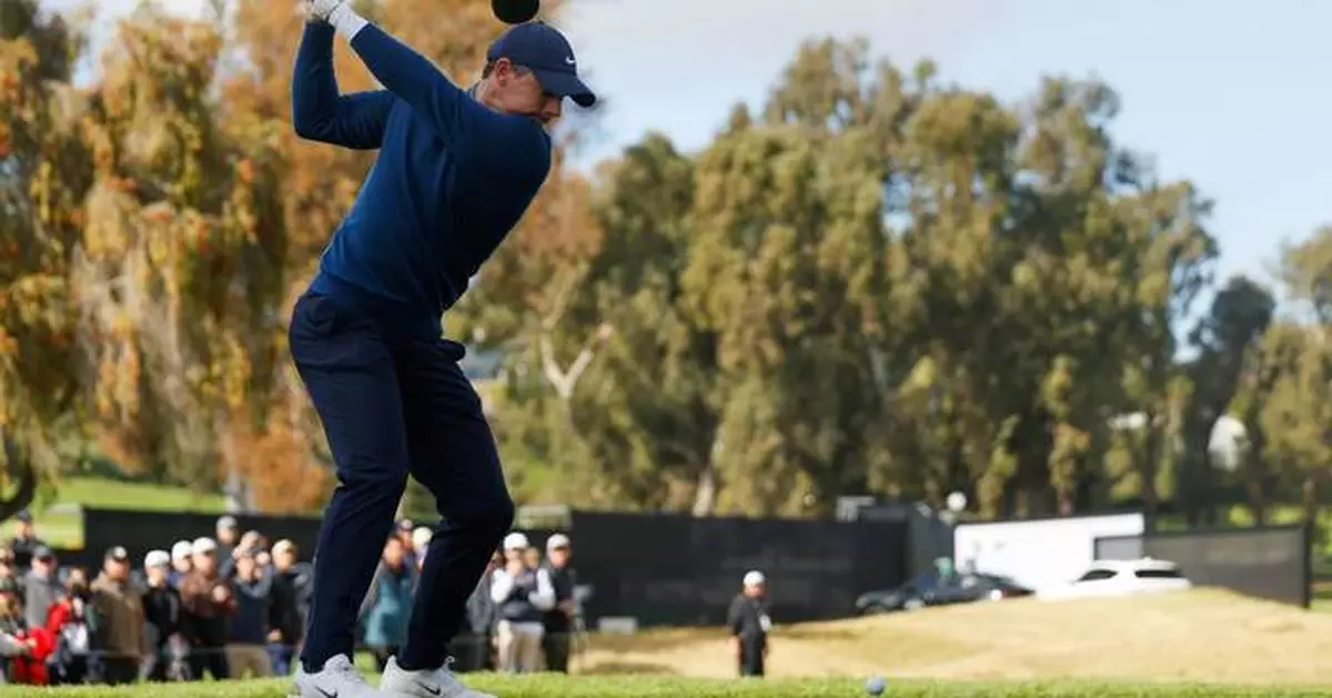 Rory McIlroy handles the rain and then wind to share clubhouse lead at Riviera
