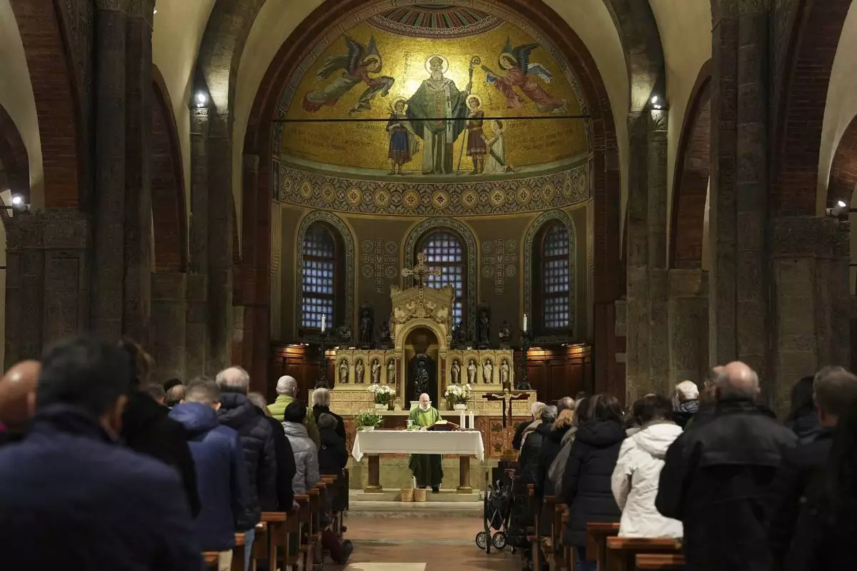 Worshippers attend one of several multilingual Masses at the Basilica of San Babila, also known as the Church of Athletes during the 2026 Winter Olympics, in Milan, Italy, Saturday, Feb. 8, 2026. (AP Photo/María Teresa Hernandez)