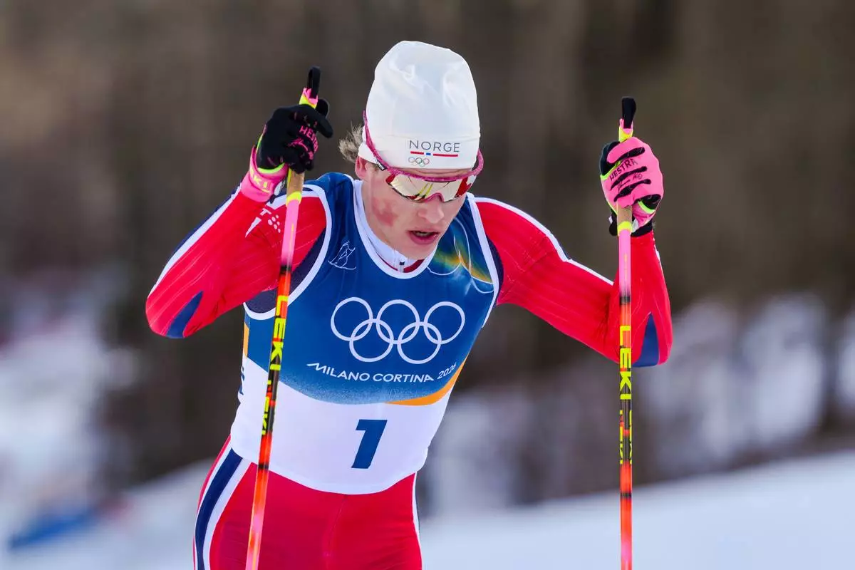 Johannes Hoesflot Klaebo, of Norway, competes in the cross country skiing men's 10km + 10km skiathlon at the 2026 Winter Olympics, in Tesero, Italy, Sunday, Feb. 8, 2026. (AP Photo/Evgeniy Maloletka)