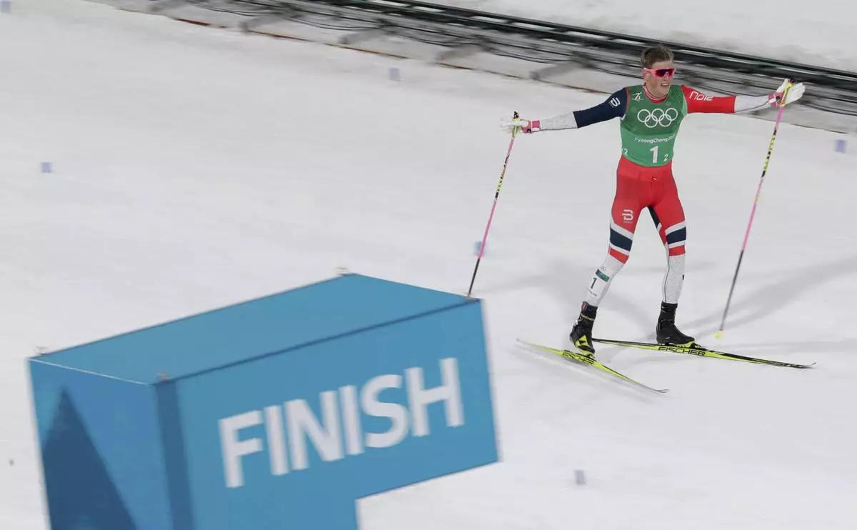 FILE - Johannes Hoesflot Klaebo, of Norway, celebrates after winning the gold medal in the men's team sprint freestyle cross-country skiing final at the 2018 Winter Olympics in Pyeongchang, South Korea, Feb. 21, 2018. (AP Photo/Dmitri Lovetsky, File)