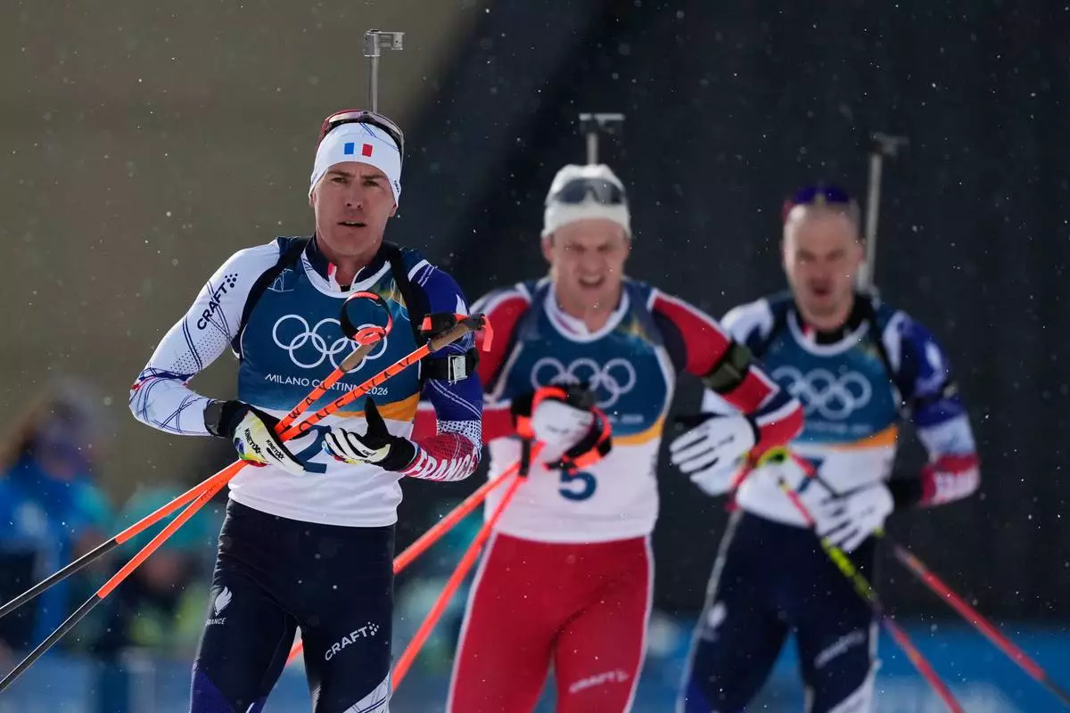 Quentin Fillon Maillet, of France, competes in the men's 15-kilometer mass start biathlon race at the 2026 Winter Olympics in Anterselva, Italy, Friday, Feb. 20, 2026. (AP Photo/Mosa'ab Elshamy)