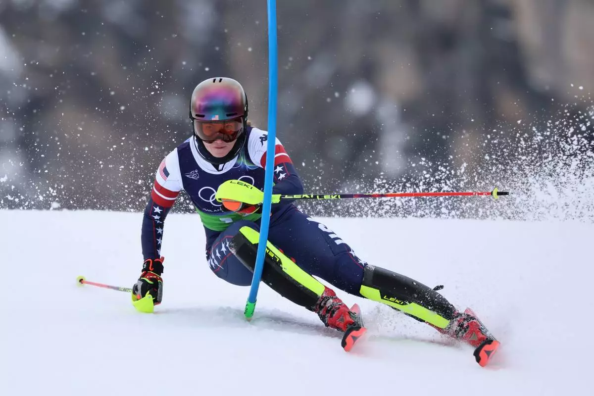United States' Mikaela Shiffrin speeds down the course during an alpine ski, slalom portion of a women's team combined race, at the 2026 Winter Olympics, in Cortina d'Ampezzo, Italy, Tuesday, Feb. 10, 2026. (AP Photo/Marco Trovati)