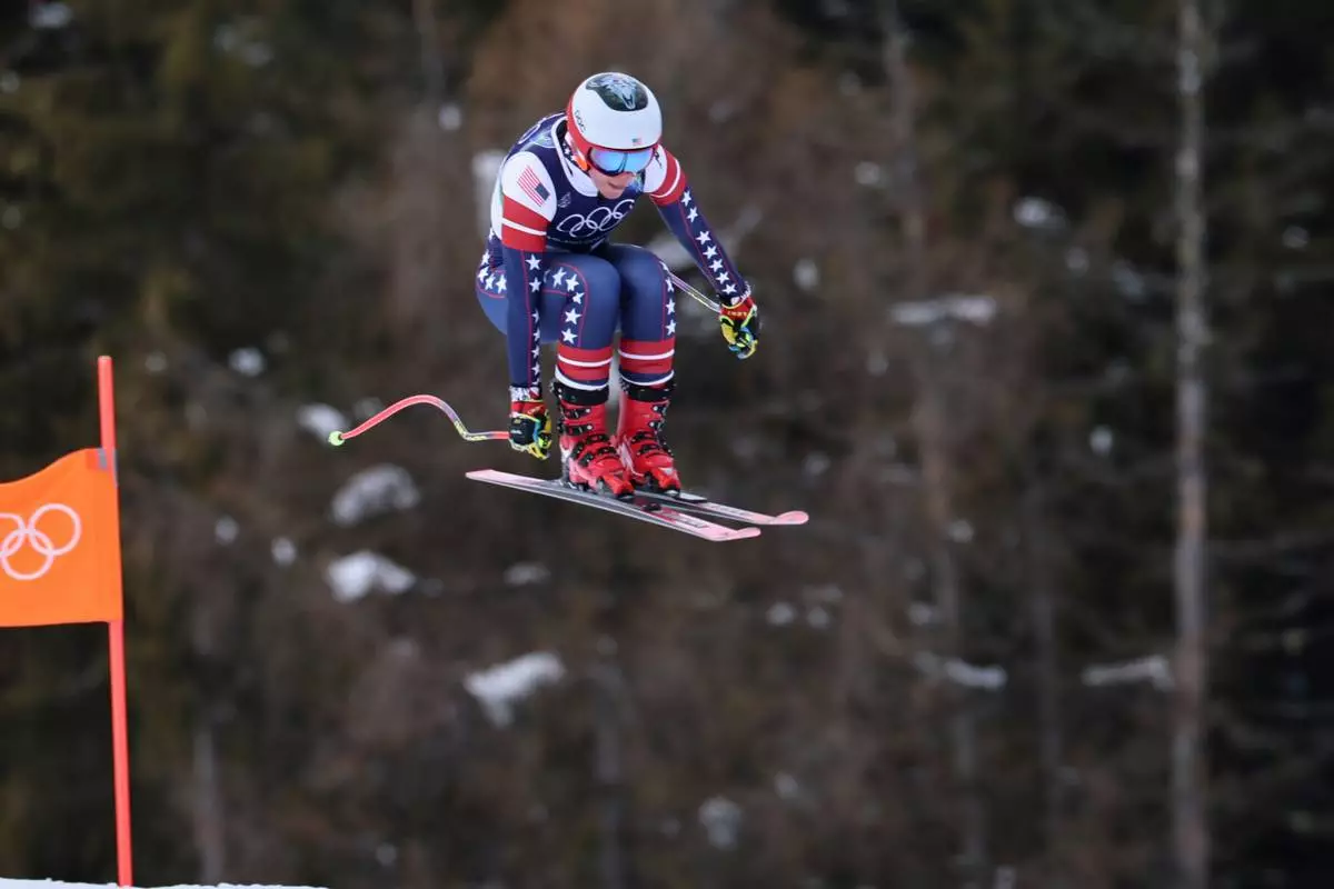 United States' Breezy Johnson speeds down the course during an alpine ski, women's downhill official training, at the 2026 Winter Olympics, in Cortina d'Ampezzo, Italy, Friday, Feb. 6, 2026. (AP Photo/Marco Trovati)