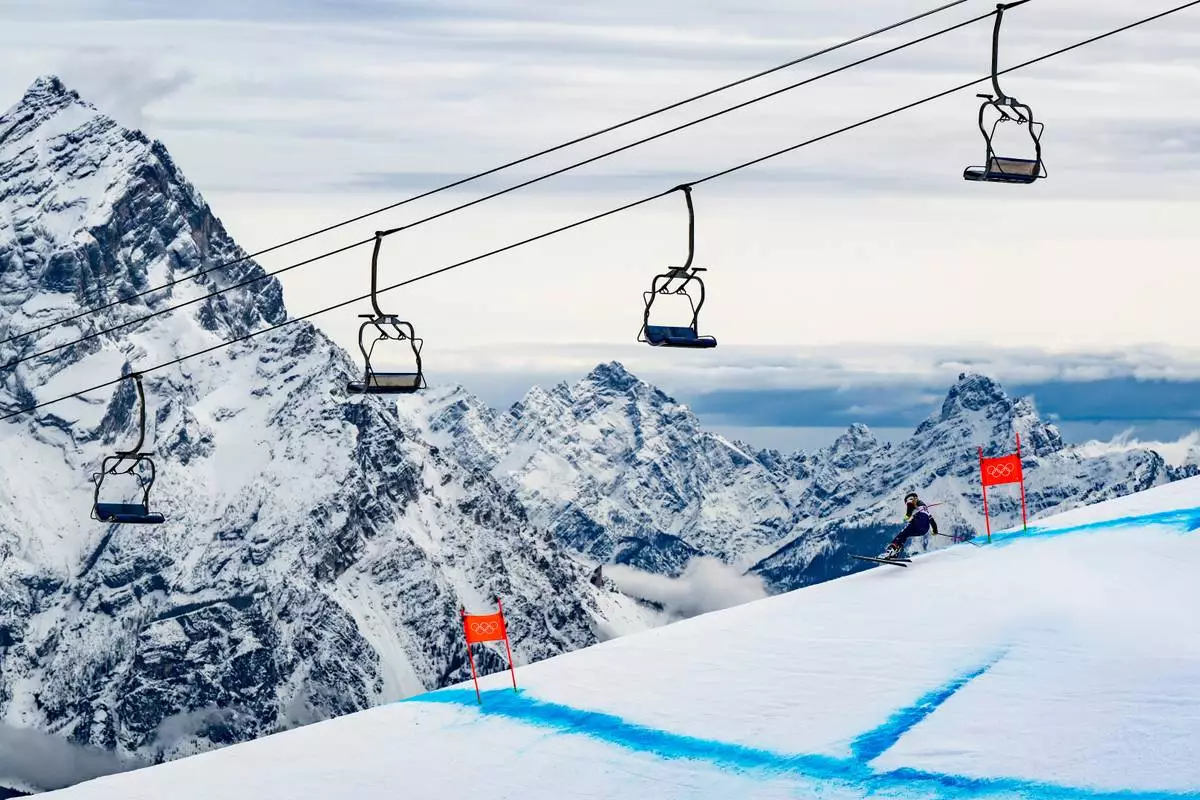 United States' Lindsey Vonn speeds down the course during an alpine ski, women's downhill official training, at the 2026 Winter Olympics, in Cortina d'Ampezzo, Italy, Friday, Feb. 6, 2026. (Jean-Christophe Bott/Keystone via AP)