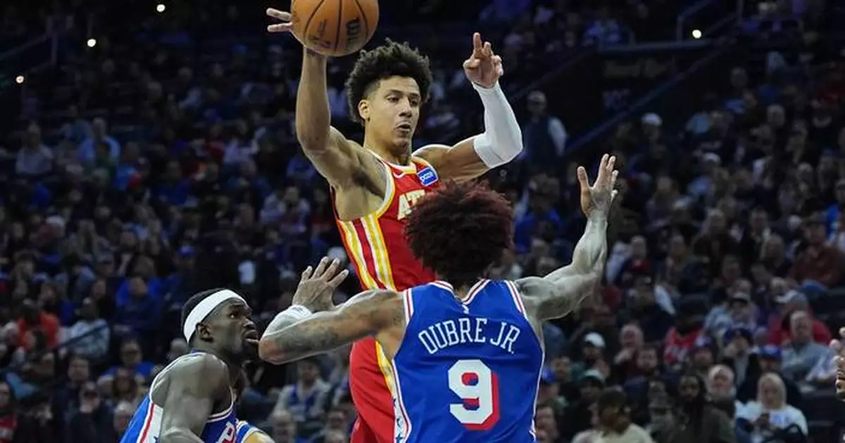 Johnson and McCollum power Hawks past the 76ers 117-107 as Atlanta snaps 3-game skid