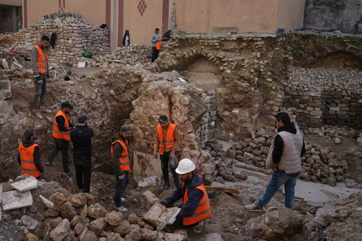 Workers inspect Hamam al-Sumara, a historic bathhouse in Gaza City, after it was heavily damaged during the Israel-Hamas war, Tuesday, Jan. 27, 2026. (AP Photo/Jehad Alshrafi)