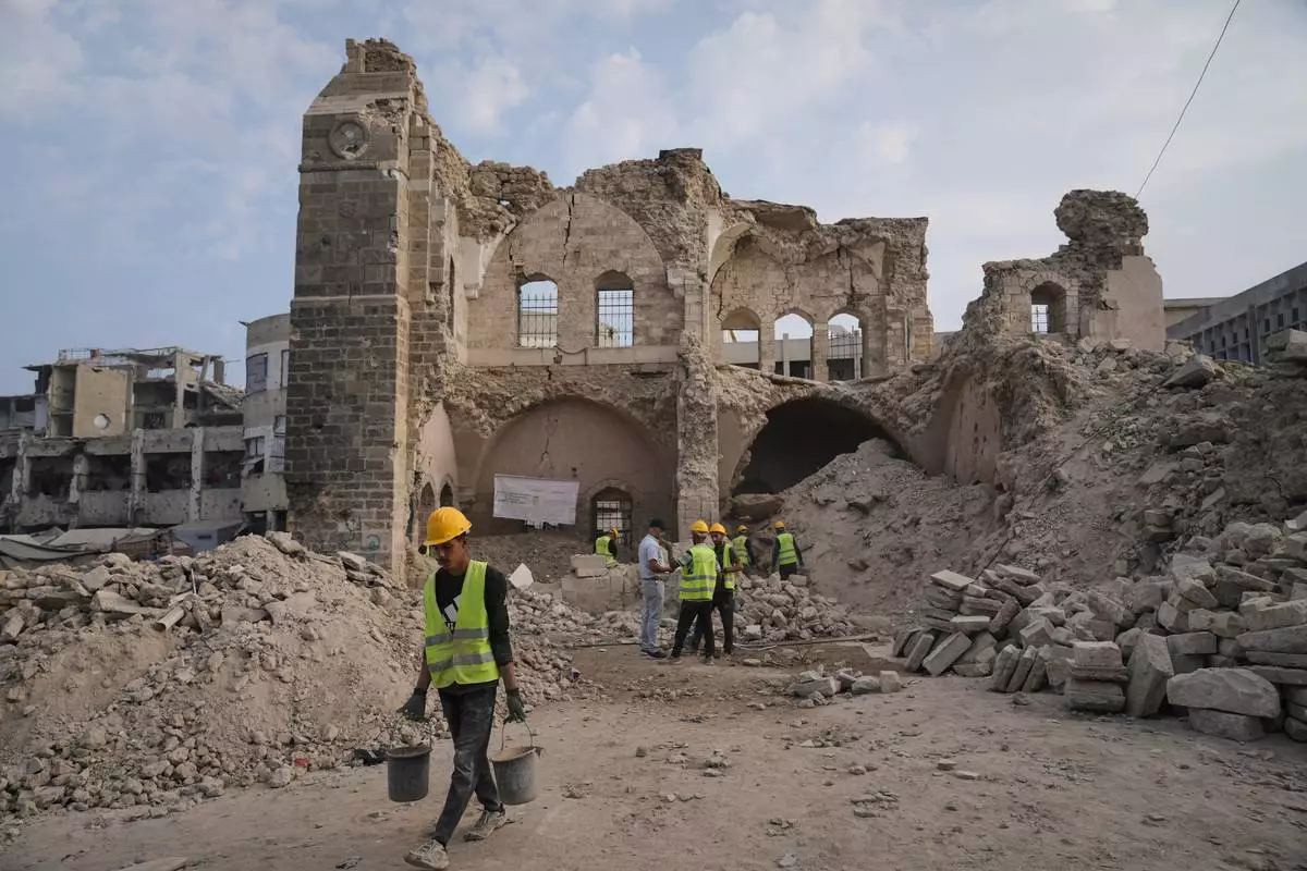 FILE - Workers carry out recovery projects and search for missing artifacts at the Pasha Palace in Gaza City after an Israeli strike damaged it during the war with Hamas, Thursday, Nov. 13, 2025. (AP Photo/Jehad Alshrafi, File)