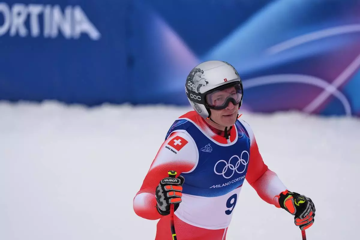 Switzerland's Marco Odermatt at the finish area, during the alpine ski, men's downhill first official training, at the 2026 Winter Olympics, in Bormio, Italy, Wednesday, Feb. 4, 2026. (AP Photo/Pier Marco Tacca)